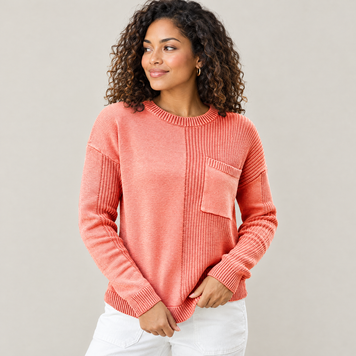 Orange mixed knit crew neck pocket sweater worn by a model