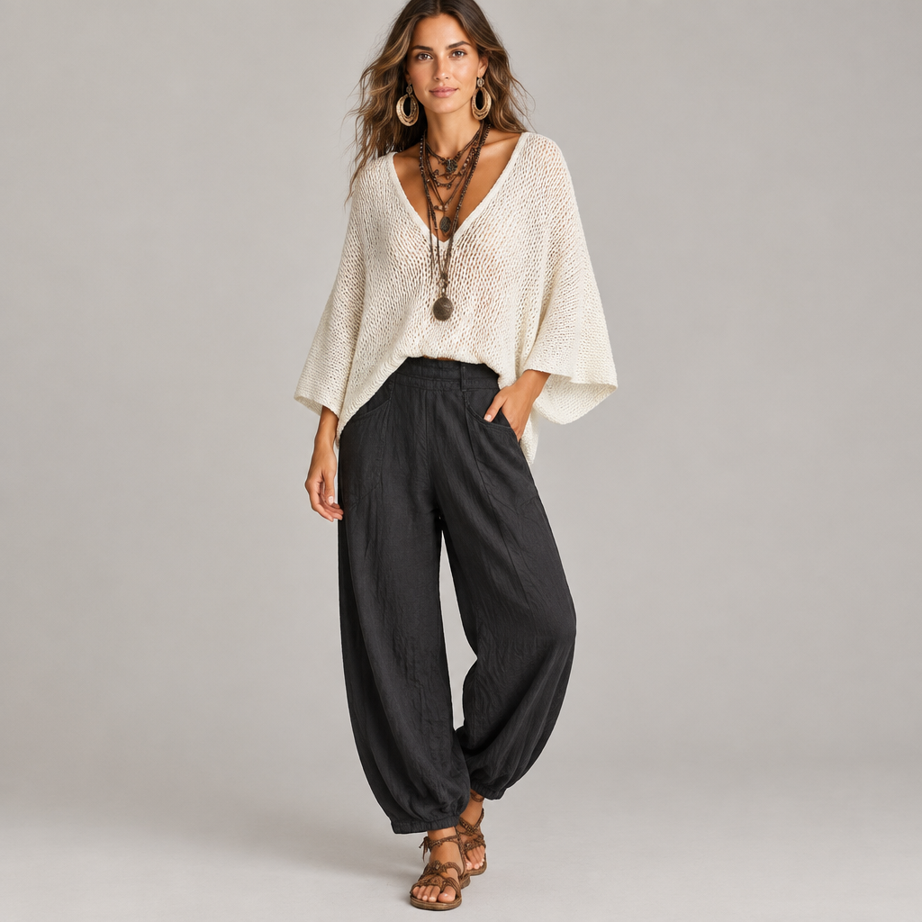 Woman wearing the cape sleeve sweater and harem pants set, front view