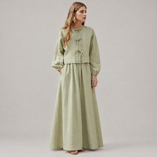 Skyler Linen Tie-Neck Balloon Sleeve Blouse in Sage Green worn by a model