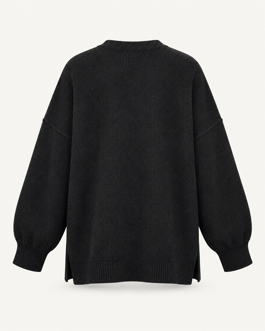 Black oversized knit pullover sweater, back view studio photo