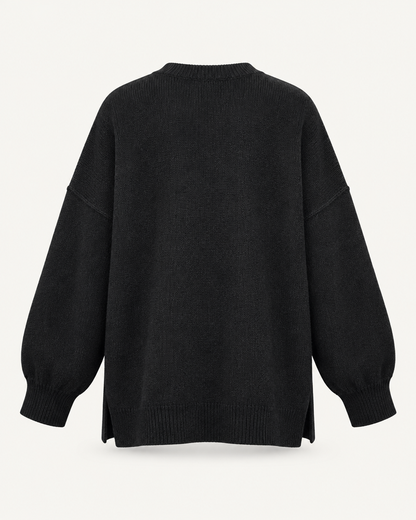 Black oversized knit pullover sweater, back view studio photo