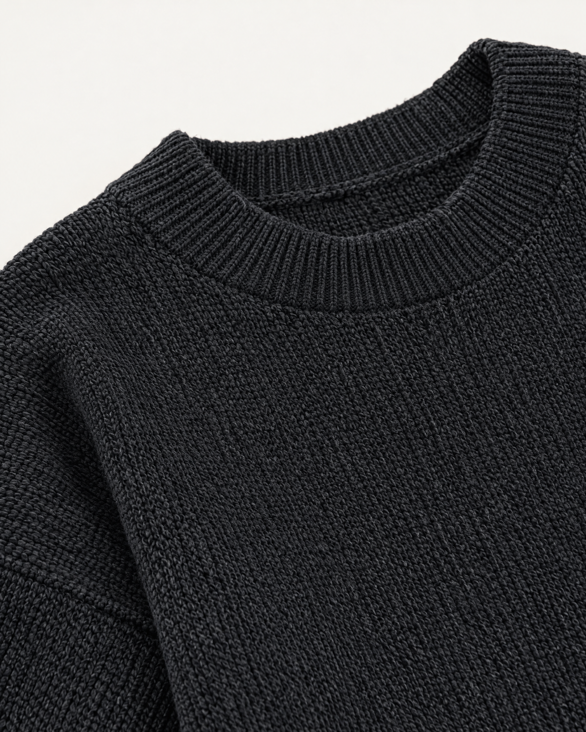 Black oversized knit pullover sweater, knit texture detail studio photo