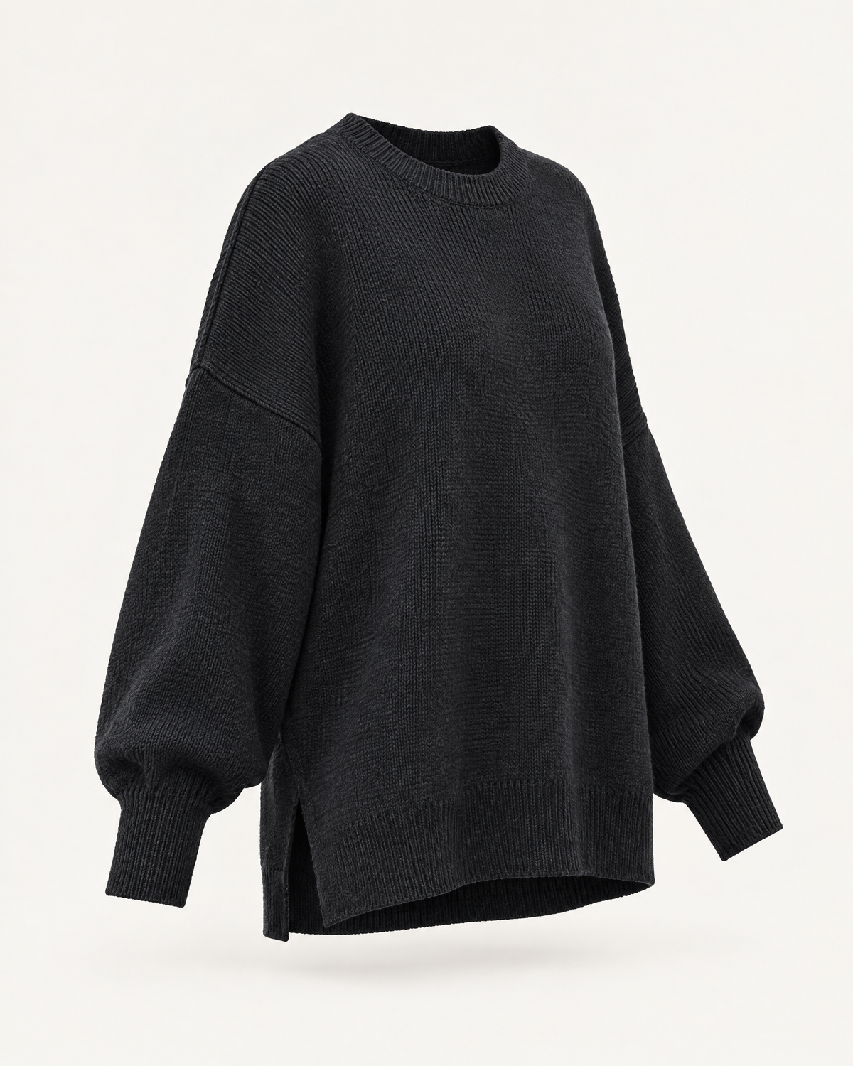 Black oversized knit pullover sweater, three-quarter view studio photo