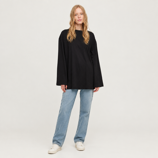 Skyler Oversized Long Sleeve Cotton Tunic Top in Black worn by a model