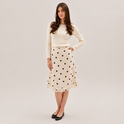 Skyler Polka Dot Ruffle Midi Skirt worn by a model