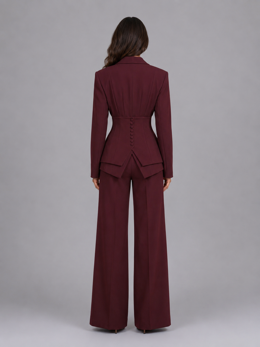 Women's two-piece pant suit with cinched waist blazer and wide-leg trousers