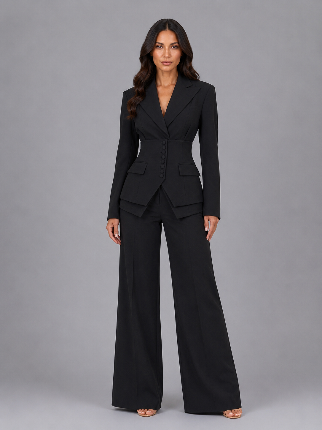 Women's two-piece pant suit with cinched waist blazer and wide-leg trousers